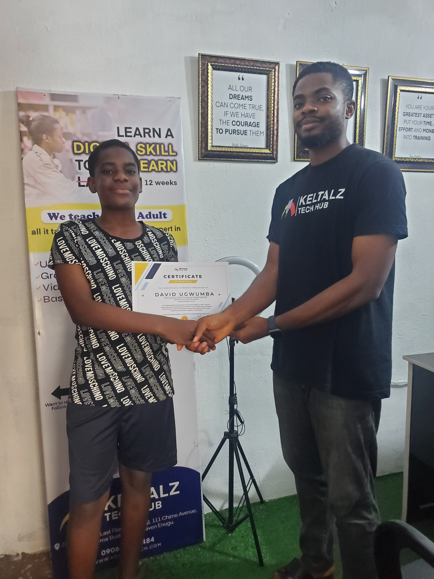 Keltalz Tech Hub certificate presentation with a student